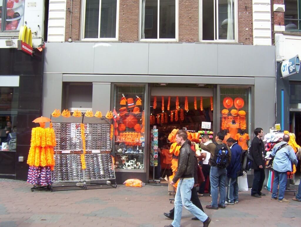 orange hats and clothes for sale on queens day, the netherlands