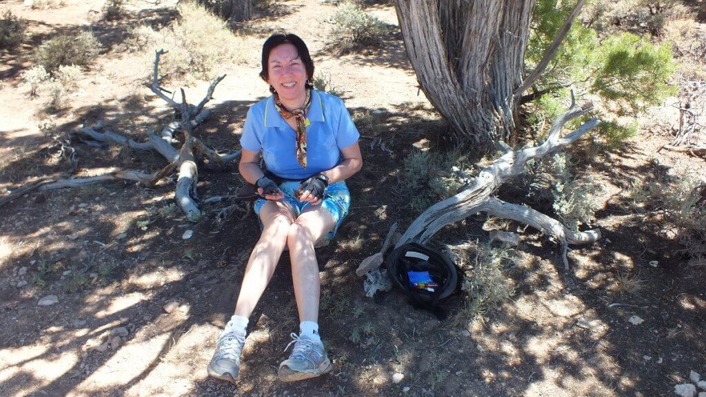 Jean holding a pinyon pine tree nut on the South Rim in Grand Canyon National Park, Arizona, U.S.A.