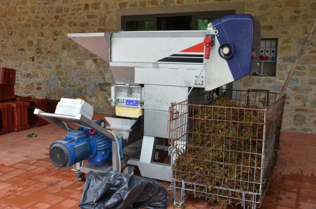 grape crusher at il colombaio di cencio vineyard, gaiole in chianti, itay