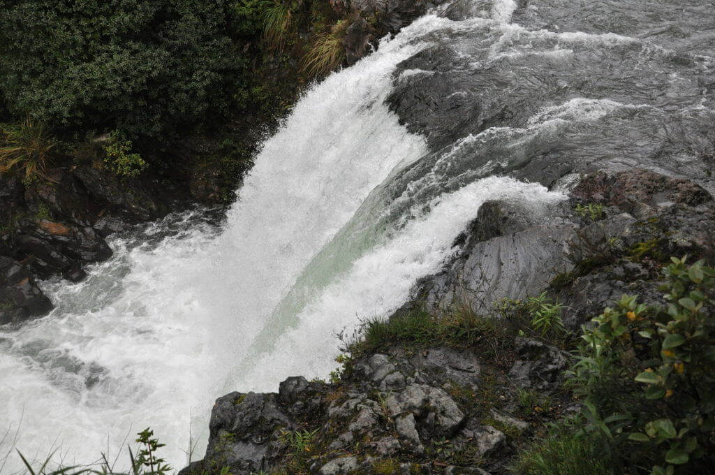 An image of water flowing over Tawhai Falls in Tongariro National Park in New Zealand. Photography by Frame To Frame - Bob and Jean.