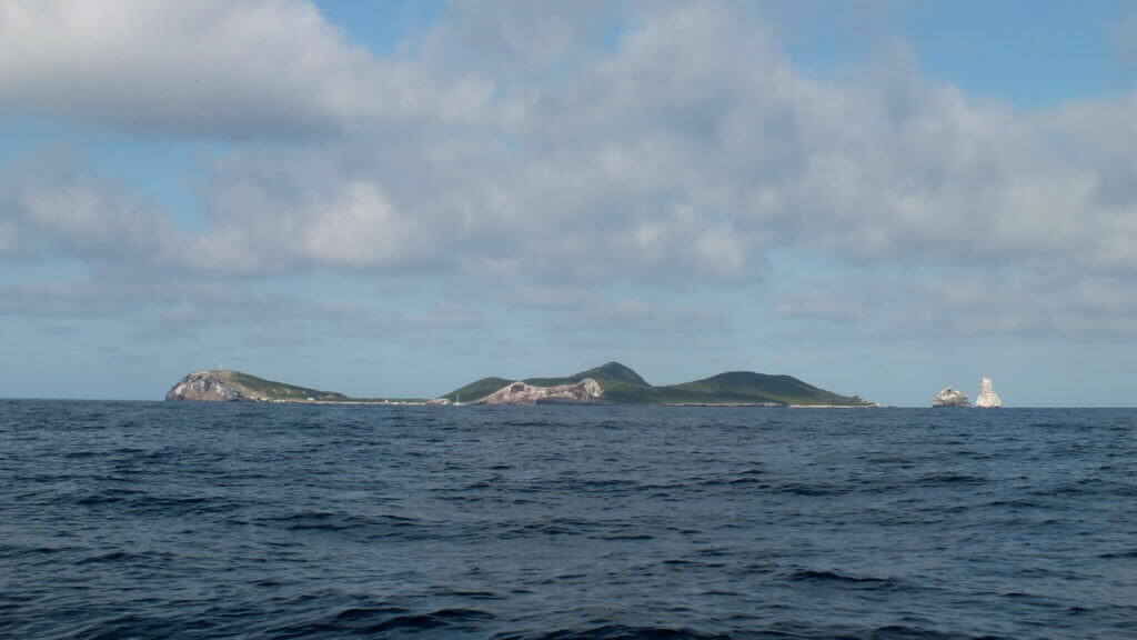 An image of Isla Isabel from a boat on the Pacific Ocean off San Blas, Mexico. Photography by Frame To Frame - Bob and Jean