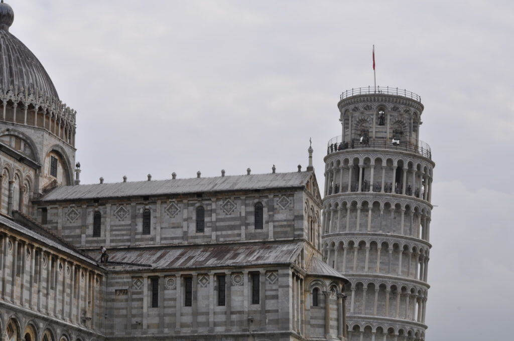 An image of the Leaning Tower of Pisa beside the Pisa Cathedral in Tuscany, Italy. Photography by Frame To Frame - Bob and Jean. 