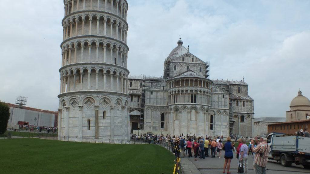 An image of people standing below the Leaning Tower of Pisa in Pisa, Italy. Photography by Frame To Frame - Bob and Jean