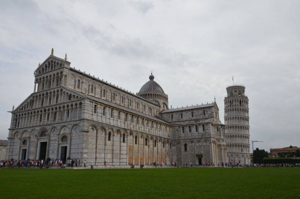 An image of the Pisa Cathedral with the Leaning Tower of Pisa behind it in Pisa, Italy. Photography by Frame To Frame - Bob and Jean