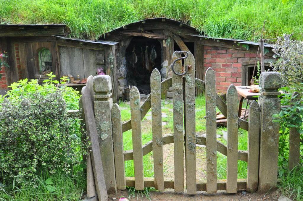 An image of a rustic wooden gate at Hobbiton in Matamata, New Zealand. Photography by Frame To Frame - Bob and Jean