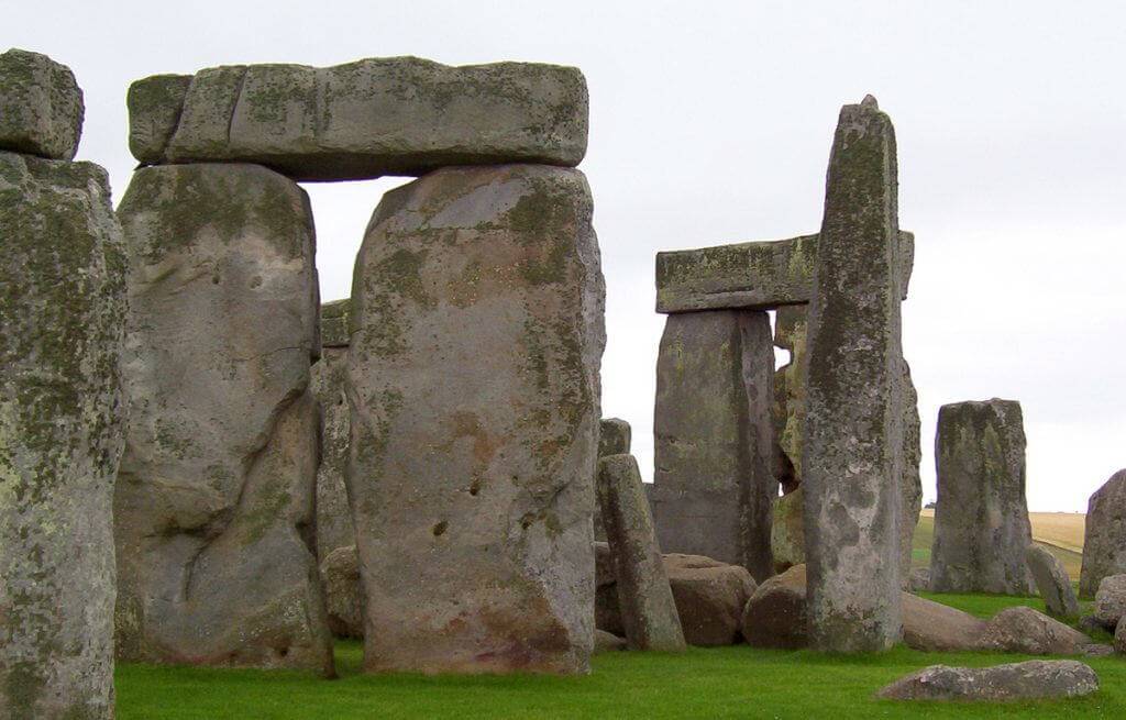 An image of the massive lintel stones sitting on the top of some of the stone pillars at Stonehenge in Wiltshire, England. Photography by Frame To Frame - Bob and Jean