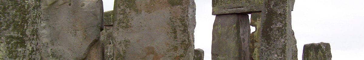 An image of the massive lintel stones sitting on the top of some of the stone pillars at Stonehenge in Wiltshire, England. Photography by Frame To Frame - Bob and Jean