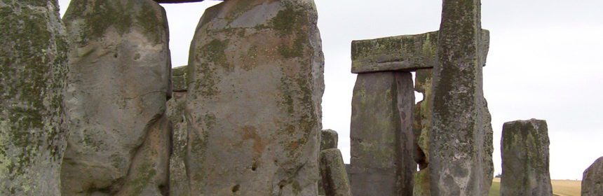 An image of the massive lintel stones sitting on the top of some of the stone pillars at Stonehenge in Wiltshire, England. Photography by Frame To Frame - Bob and Jean