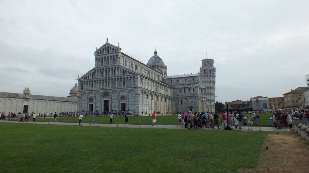An image of people walking around the Pisa Cathedral in Pisa, Italy. Photography by Frame To Frame - Bob and Jean