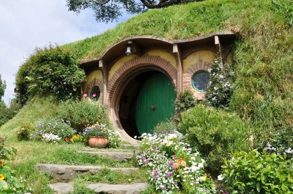 An image of the green door at Bilbo Baggins home on Bag End at Hobbiton in New Zealand. Photography by Frame To Frame - Bob and Jean.