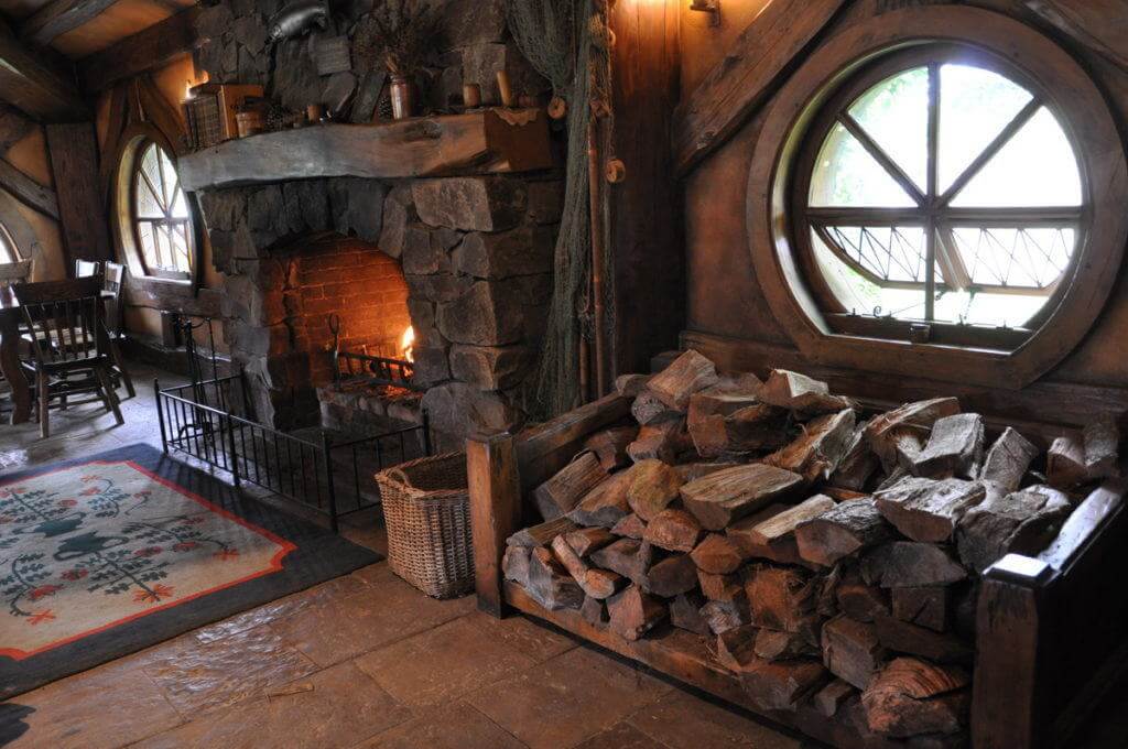 An image of the main fireplace inside the Green Dragon Pub at Hobbiton in New Zealand. Photography by Frame To Frame - Bob and Jean.