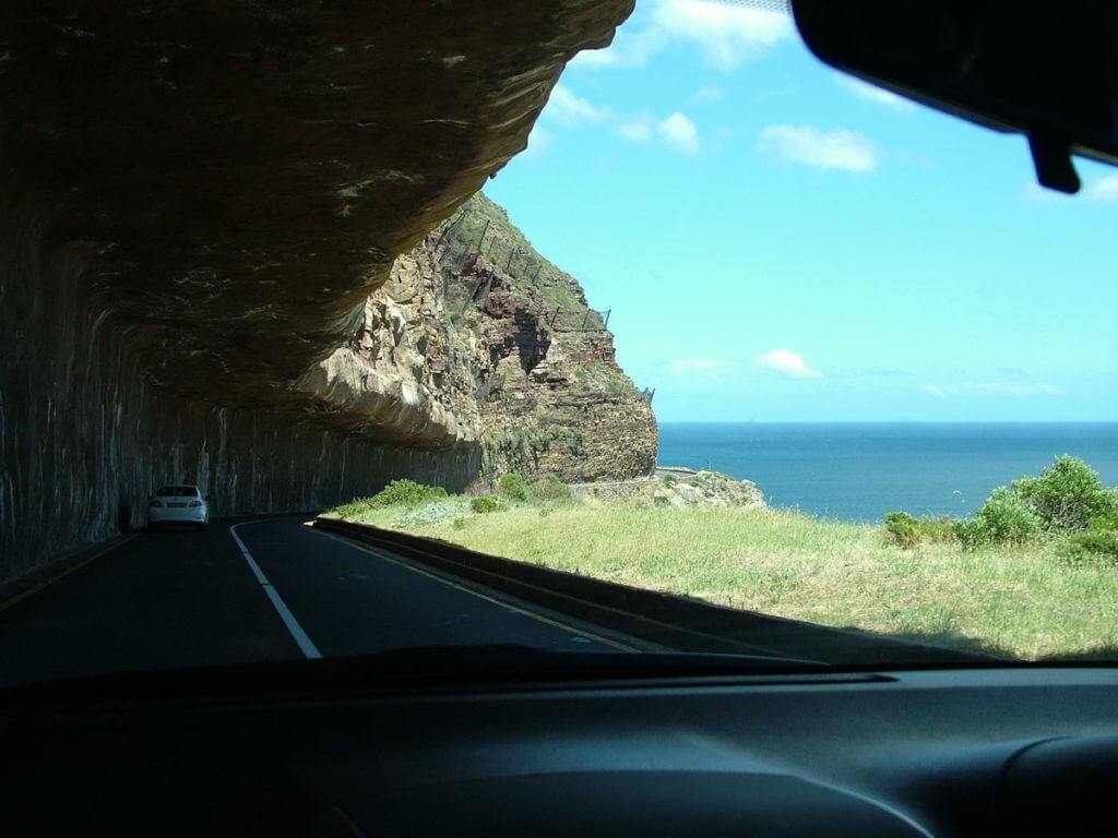 image of a roadway tunnel from Cape Town to cape peninsula and boulders beach penguin colony, table mountain national park, south africa