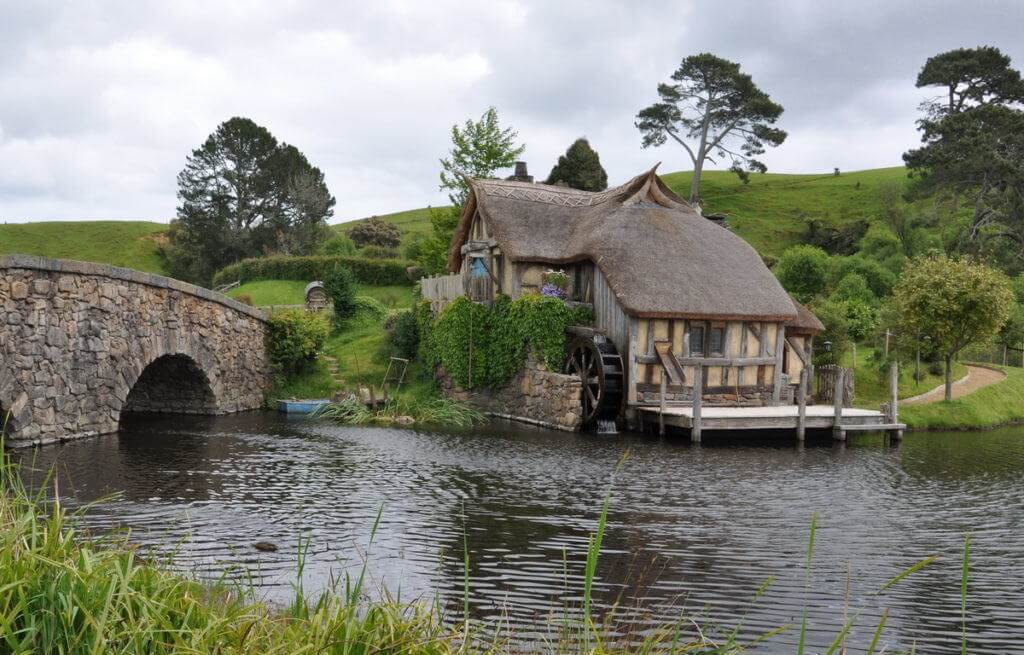 An image the old water mill at Hobbiton in New Zealand. Photography by Frame To Frame - Bob and Jean.