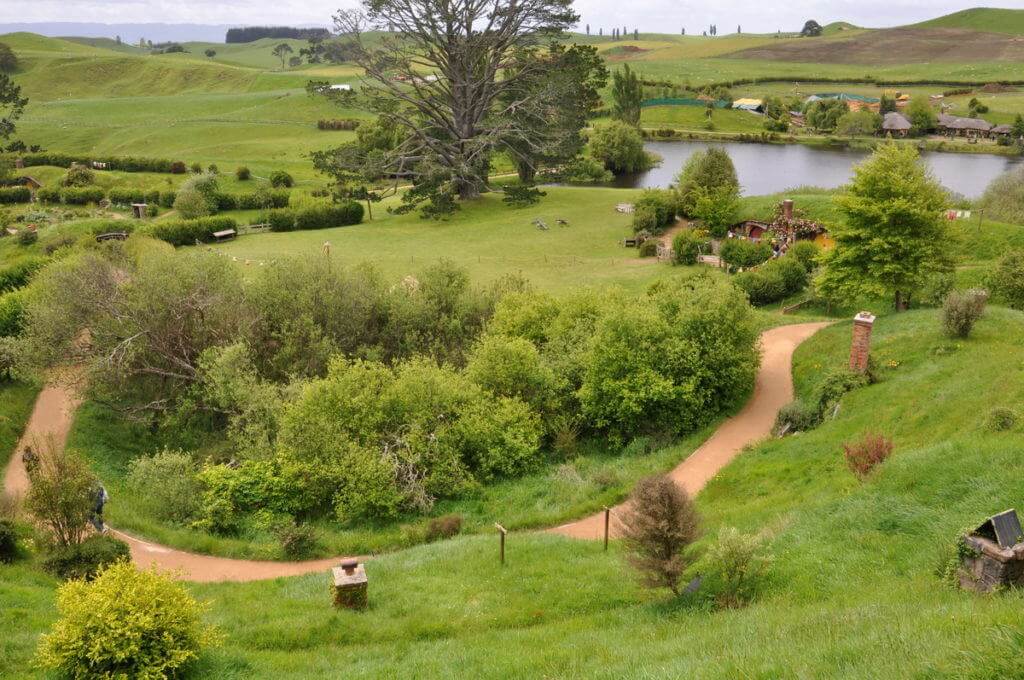 A wide angle image of the party field and distant hills at Hobbiton in Matamata, New Zealand. Photography by Frame To Frame - Bob and Jean