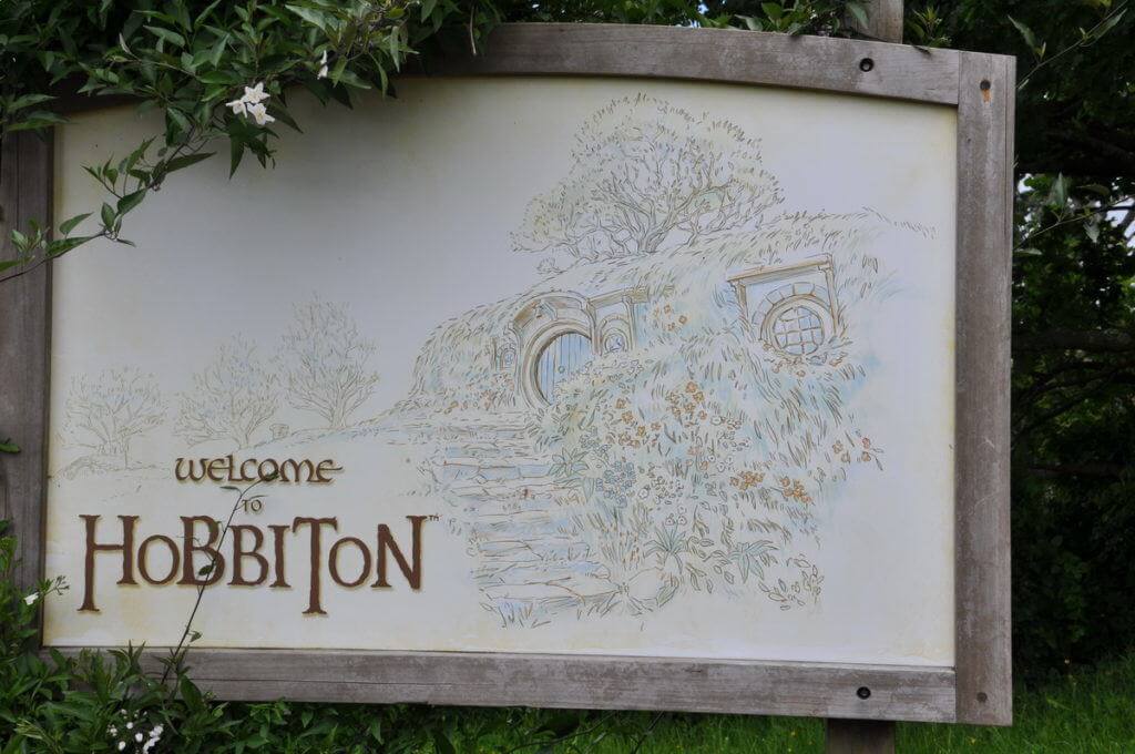 An image of the "welcome to hobbiton" sign at Hobbiton in New Zealand. Photography by Frame To Frame - Bob and Jean.