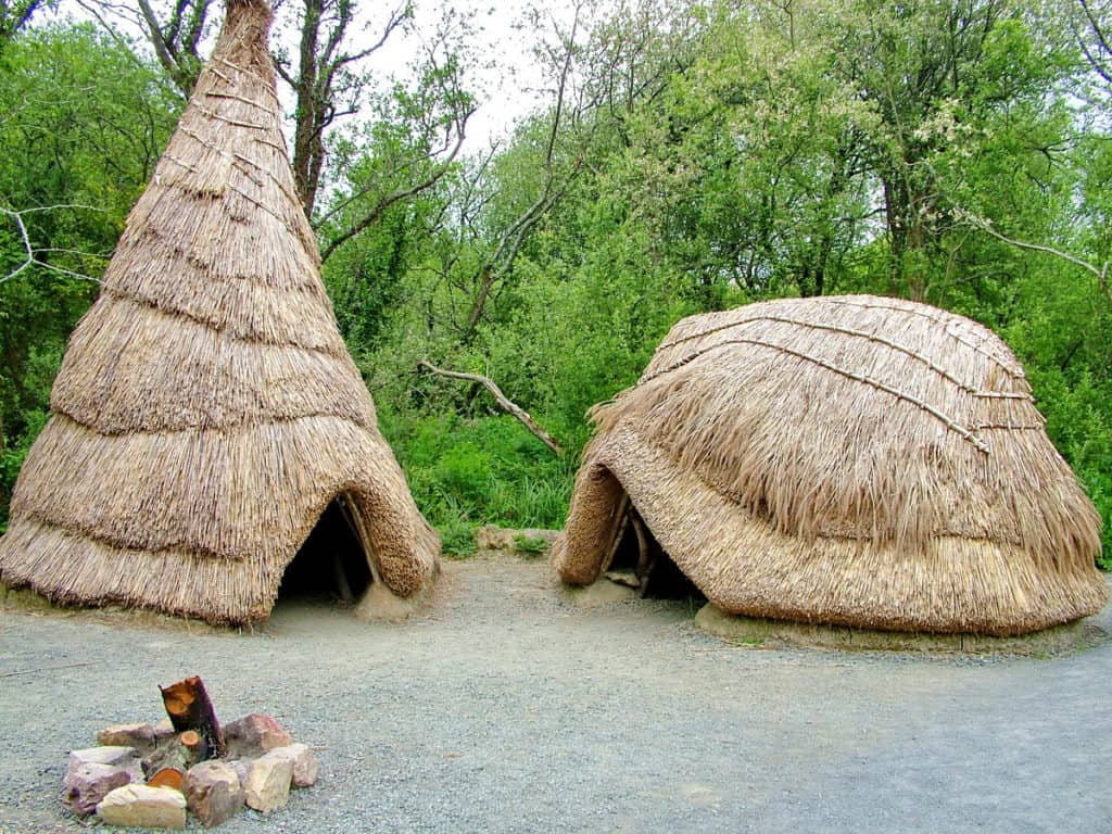 recreated thatched huts at Irish National Heritage Park in Ireland