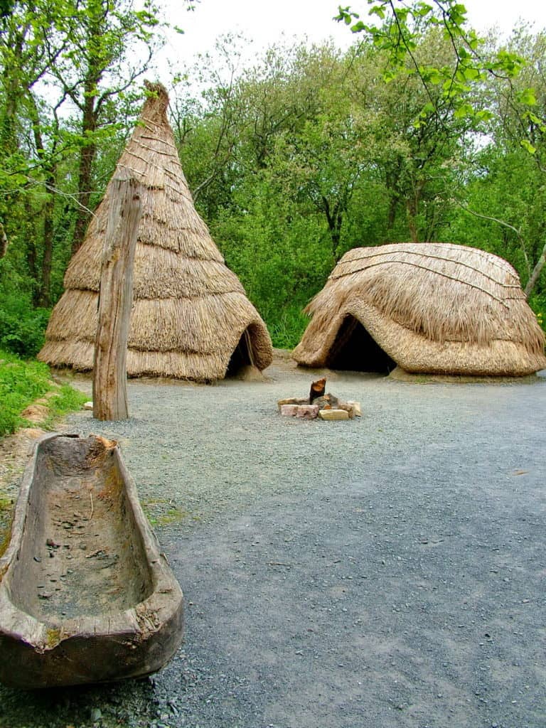 recreated thatched huts at Irish National Heritage Park in Ireland