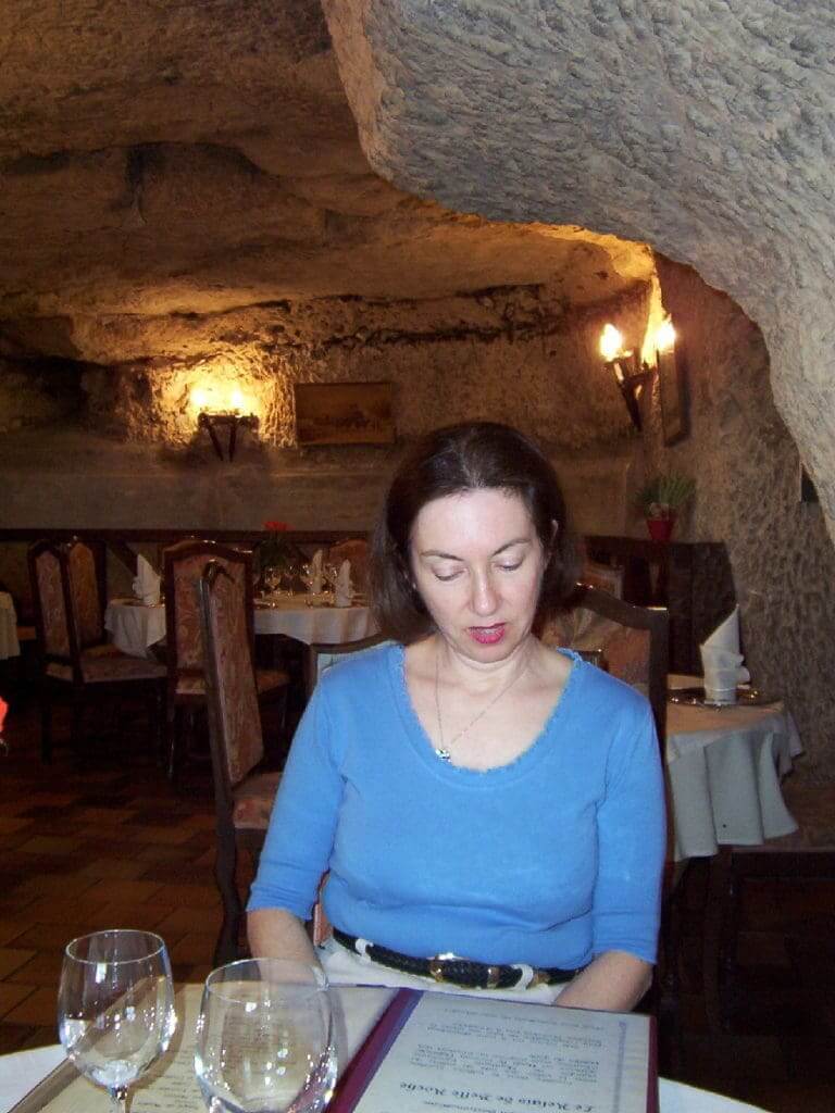 An image of Jean looking at a menu in Côté Cave Restaurant in Montlouis-Sur-Loire, France.