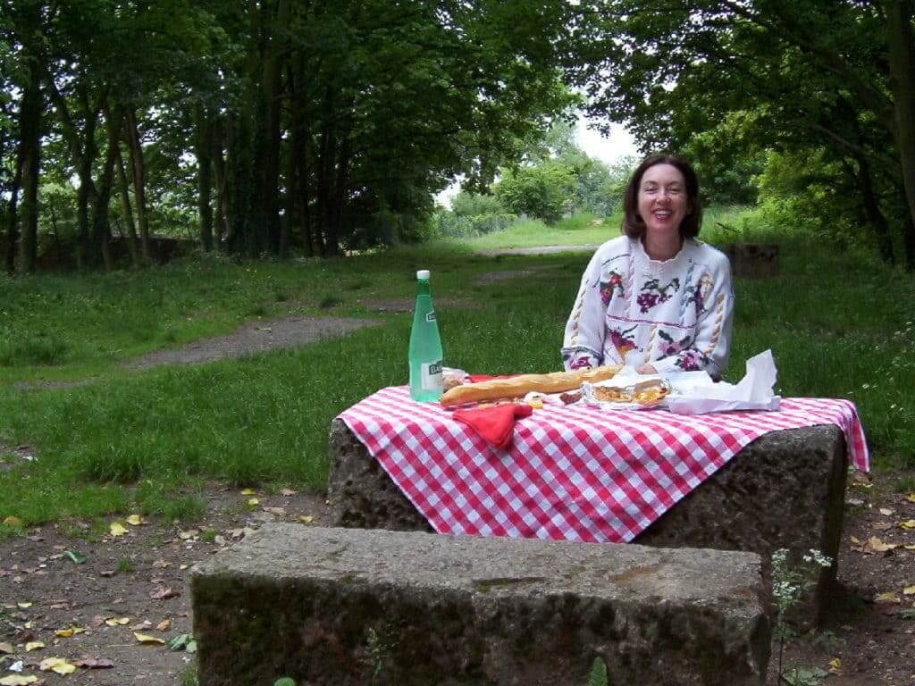 An image of Jean sitting at a picnic lunch near Giverny in France.