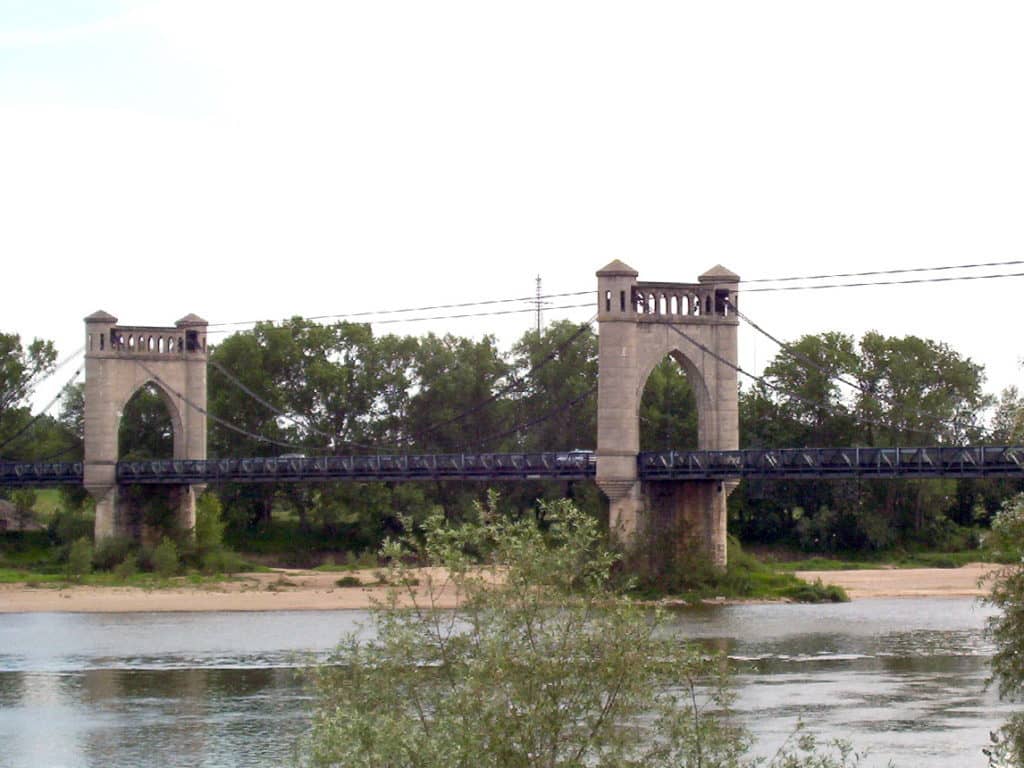 An image of the multi-span suspension bridge across the Loire River in the town of Langeais in France.