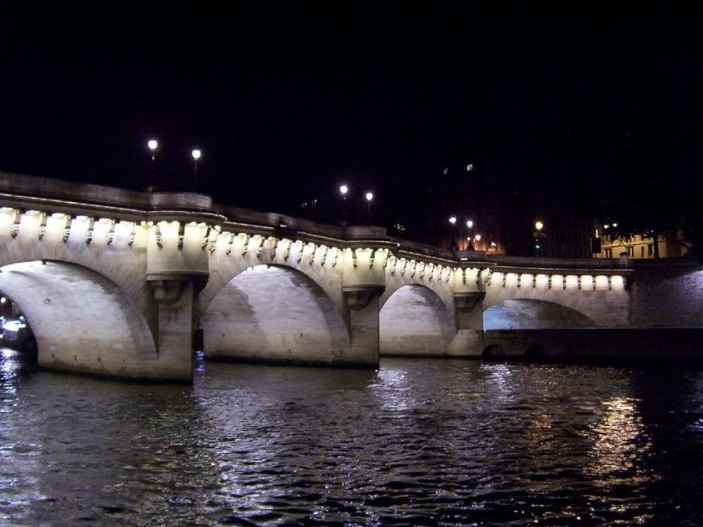 Pont Neuf at night time in Paris, France.