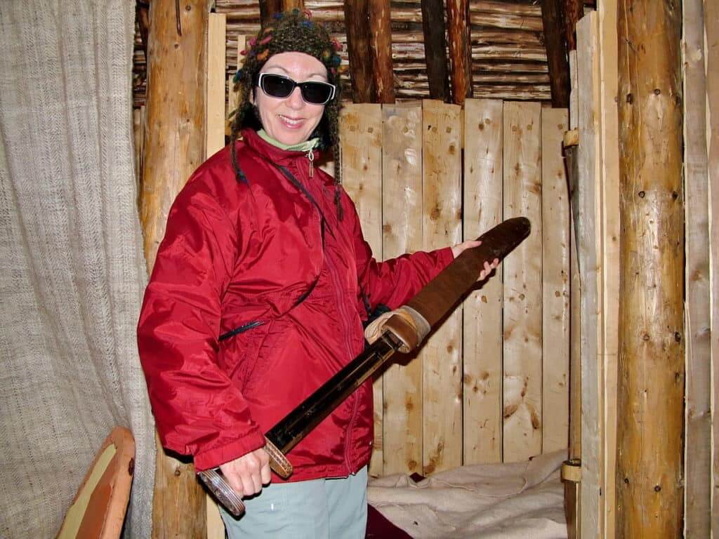 jean unsheaths a viking sword at l'anse aux meadows, newfoundland, canada