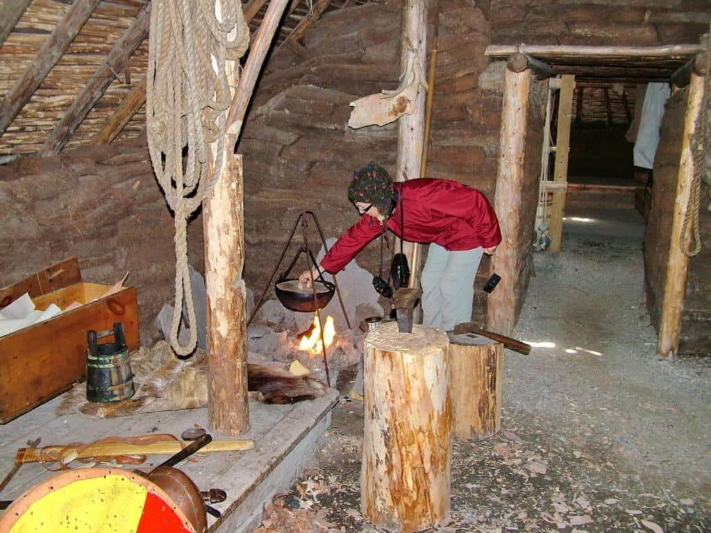interior of a re-created Viking longhouse at l'anse aux meadows, newfoundland, canada