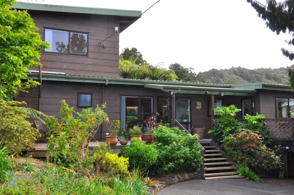 An image of Lone Kauri Lodge in the Waitakere Hills near Auckland, New Zealand.