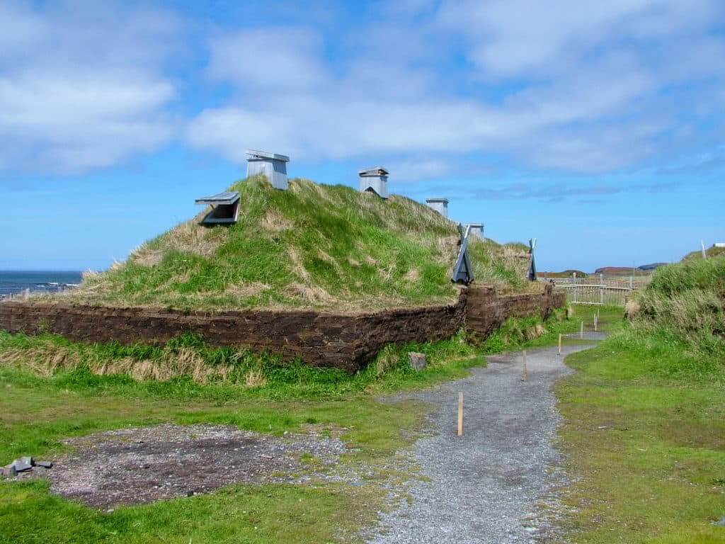a re-created longhouse at l'anse aux meadows, newfoundland, canada
