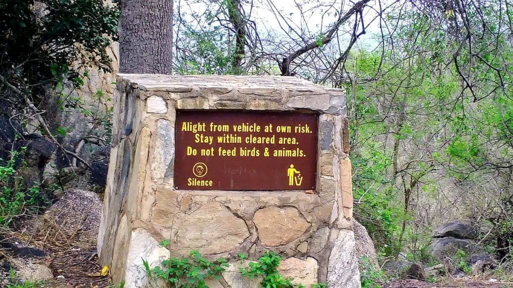 An image of warning sign at Shirimantanga Hill in Kruger National Park, South Africa. Photography by Frame To Frame - Bob and Jean.