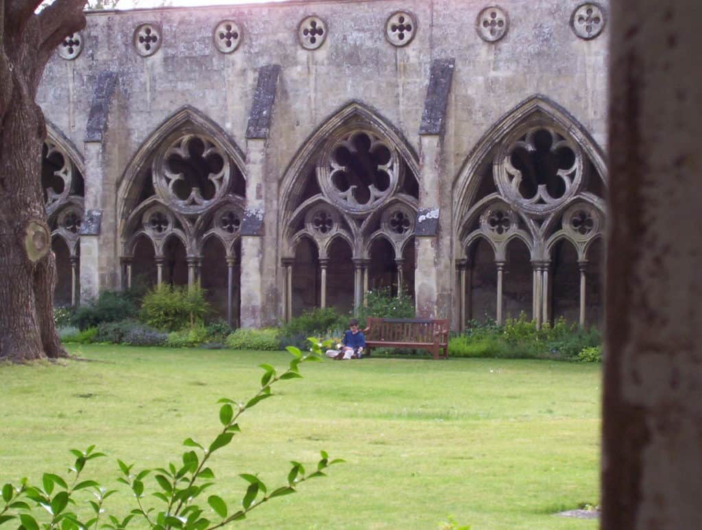 Image of the green lawn inside the cloister garden at Salisbury Cathedral in England.