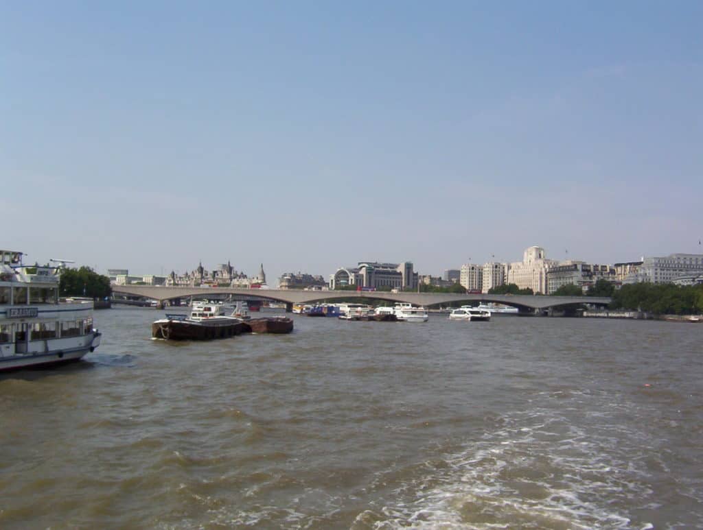 An image of boats on the Thames River in London, England.