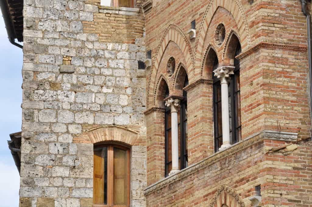 Image of gothic arches on one of the building's in San Gimignano, Italy.