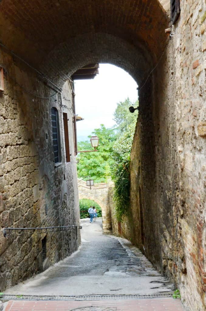 Image of a laneway inside San Gimignano, Italy.