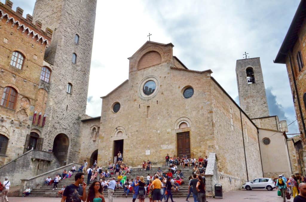 Image of the Collegiate Church overlooking Piazza del Duomo in San Gimignano, Italy. 