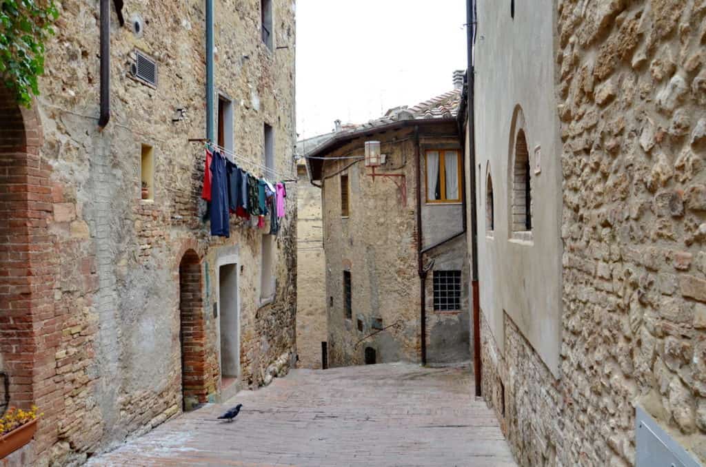 Image of laundry hanging in a laneway in San Gimignano, Italy.