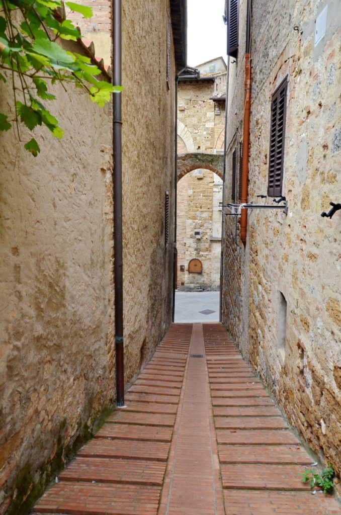 Image of a narrow roadway in San Gimignano, Italy.
