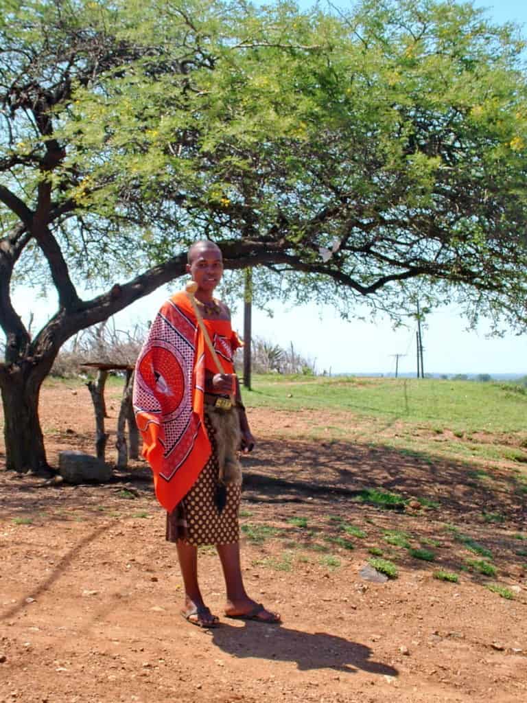 a young man in traditional dress in swaziland, africa