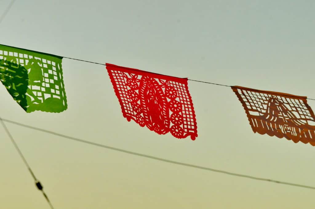 Image of ornate paper bunting at dusk in La Bajada, Mexico