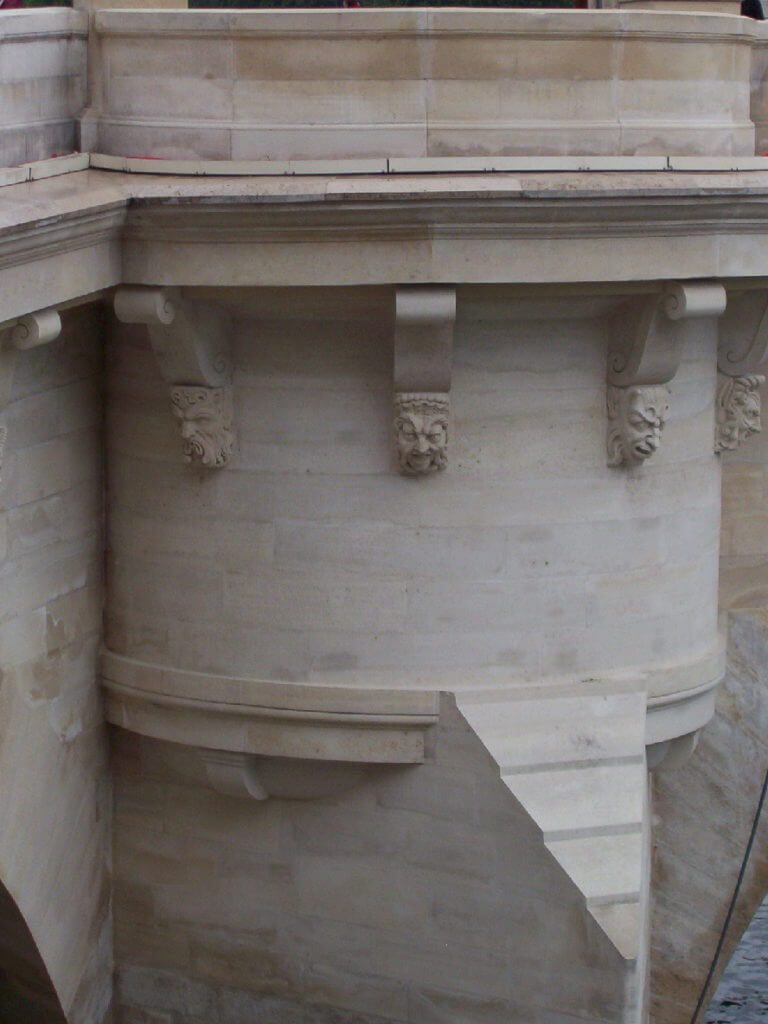 mascarons or masks on pont neuf, paris, france