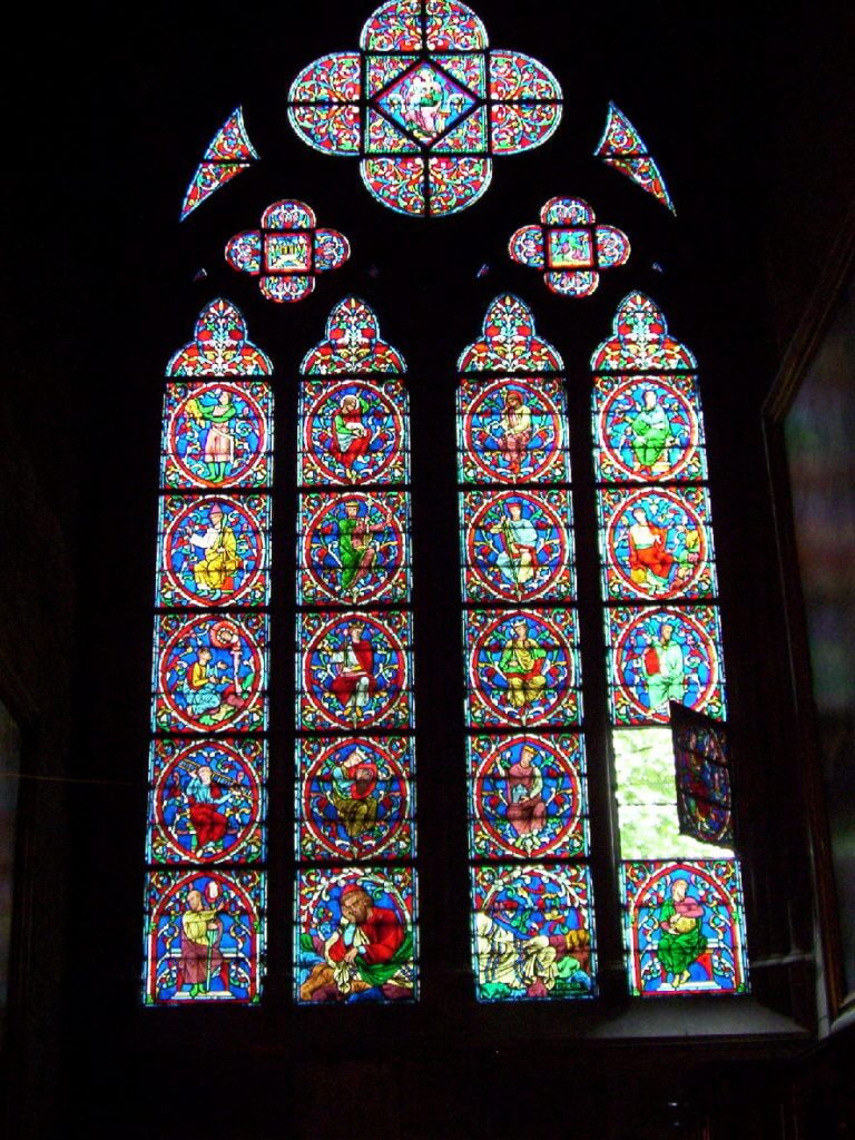 stained glass window inside notre dame cathedral, paris, france