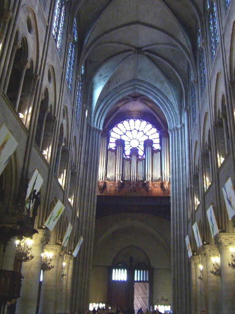 the nave inside notre dame cathedral, paris, france