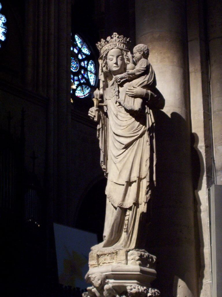 statue of virgin and child inside notre dame cathedral, paris, france