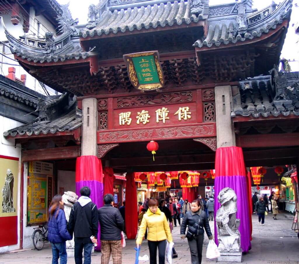 People entering the main street gate to the City God Temple of Shanghai, in Shanghai, China.