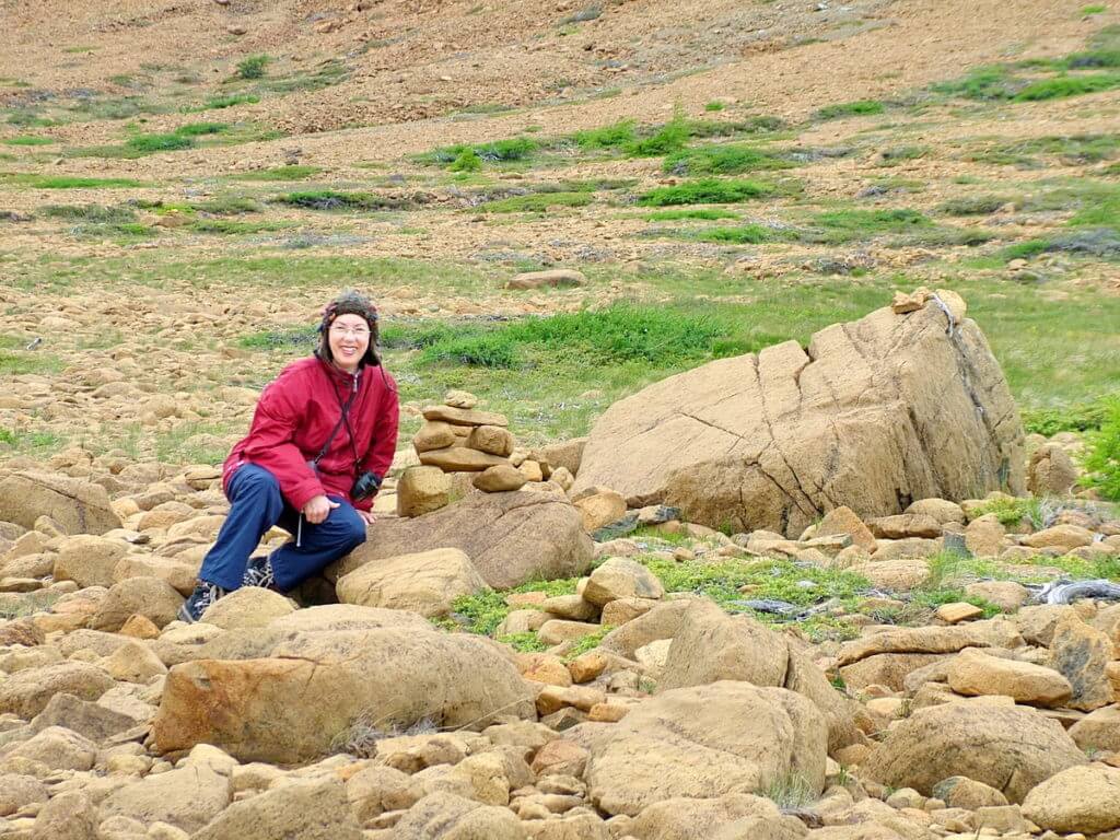 jean among peridotite rocks, the tablelands, newfoundland, canada