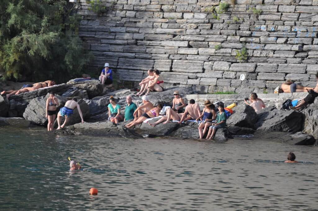 sunbathers, vernazza, cinque terre, italy