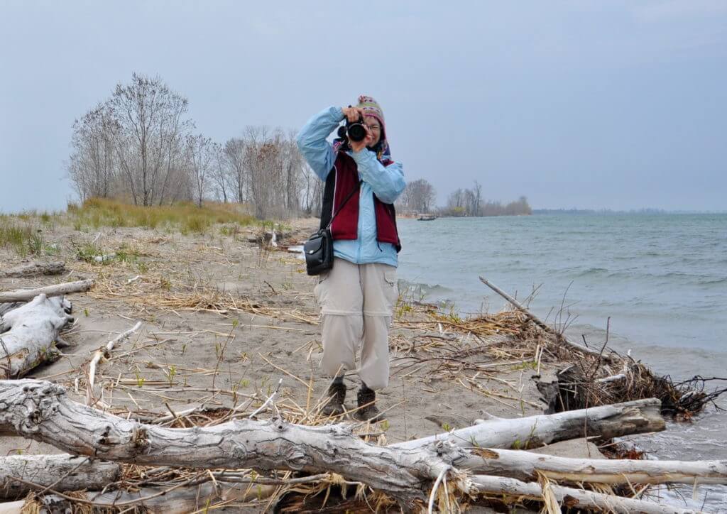 jean taking a photo at the tip of long point, lake erie, ontario 