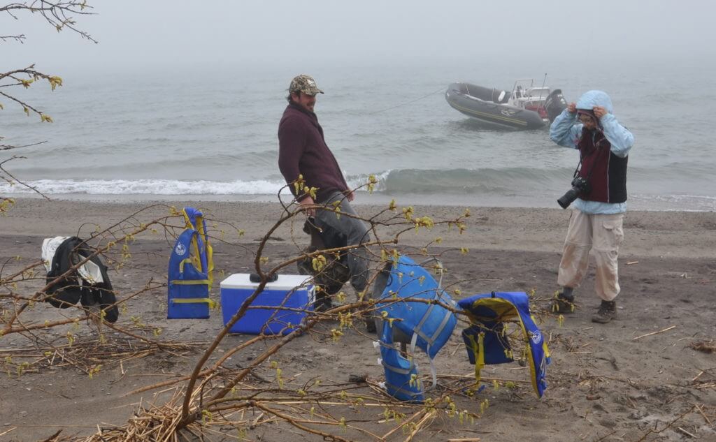 unloading a zodiak, the tip of long point, lake erie, ontario