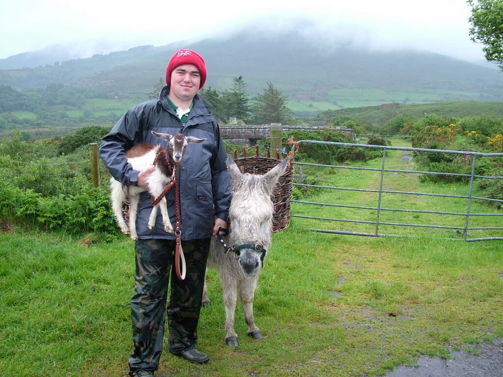 a goatherd and his goat and donkey, killorglin, ring of kerry, ireland