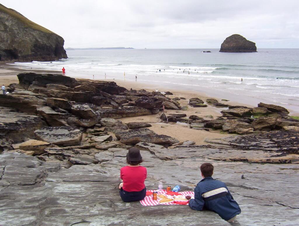 picnickers at trebarwith strand beach, cornwall, england